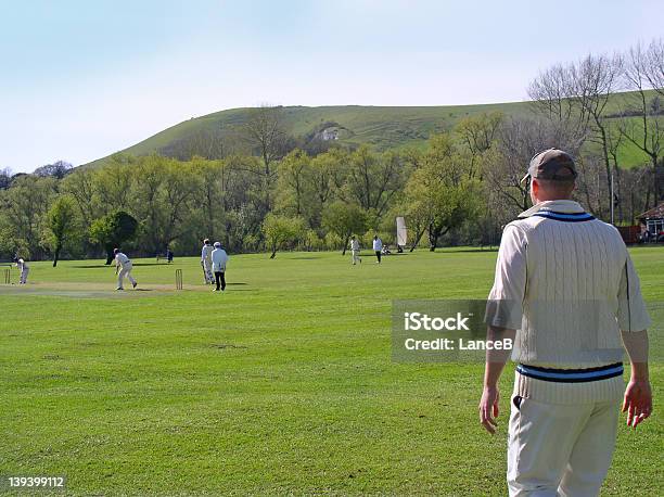 Cricket On Village Green Stock Photo - Download Image Now - Sport of Cricket, Village, Sussex