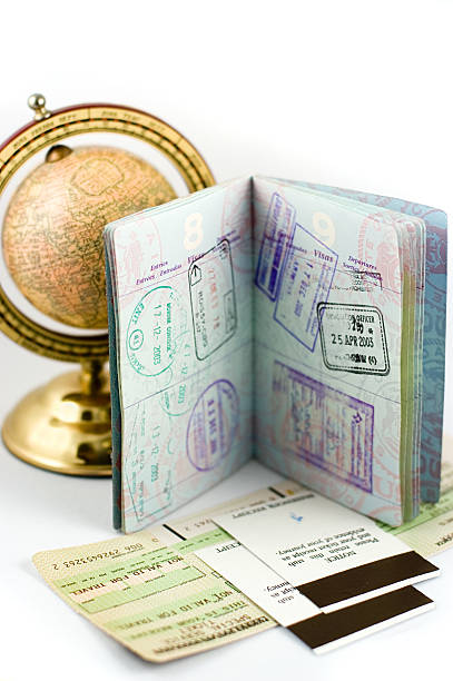 istock Stamps in a passport with a globe in the background 139399117