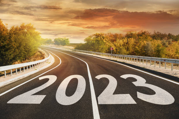 istock Start new year with fresh vision and ideas. 2023 numbers on asphalt road 1393991184