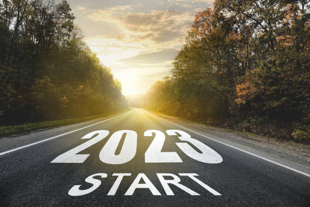 istock Start new year with fresh vision and ideas. 2023 numbers on asphalt road 1393992223