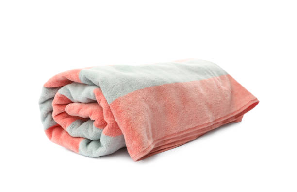 istock Rolled striped beach towel isolated on white 1393993427