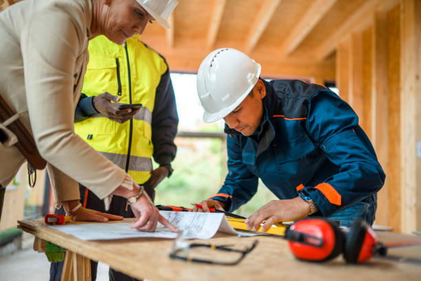 istock Mature Female Architect Leads Construction Of A Timber Warehouse 1393993433