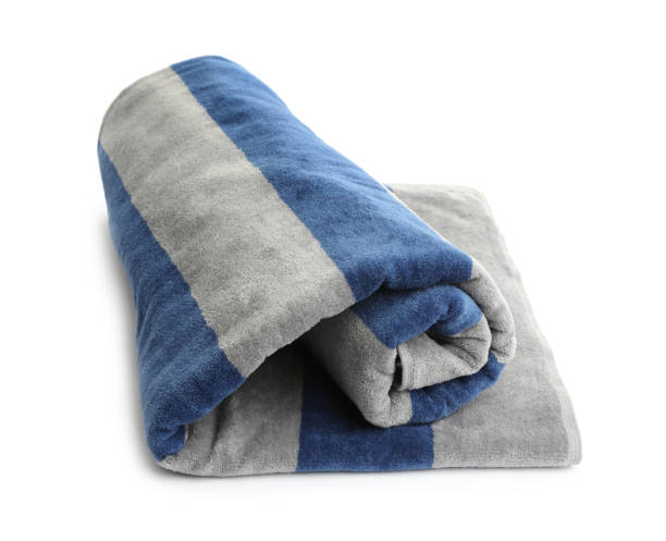 istock Rolled striped beach towel isolated on white 1393994261
