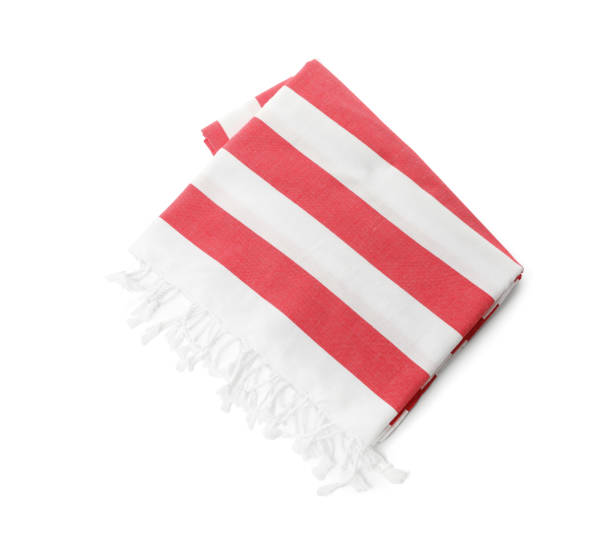 istock Folded striped beach towel isolated on white, top view 1393994270