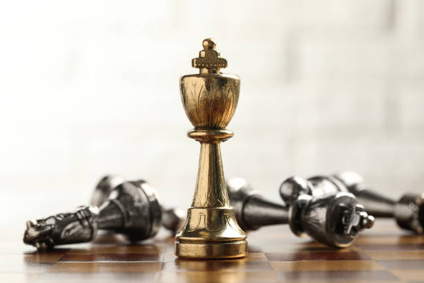 istock Chessboard with game pieces on light background, closeup 1393994610