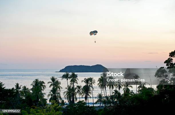 Parasailing Over Manuel Antonio At Dusk Costa Rica Stock Photo - Download Image Now