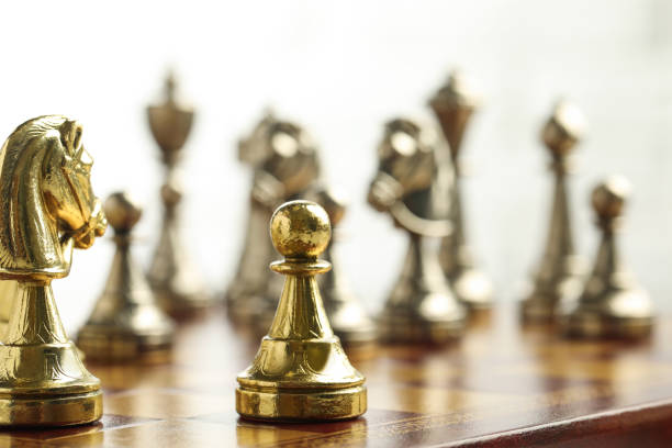 istock Chessboard with game pieces on light background, closeup 1393995206