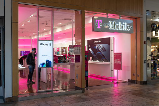 Indianapolis - Circa January 2021: T-Mobile Retail Wireless Store. T-Mobile merged with Sprint in hopes of advancing 5G development.