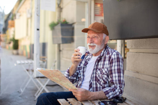 istock Senior man exploring the city 1393996205