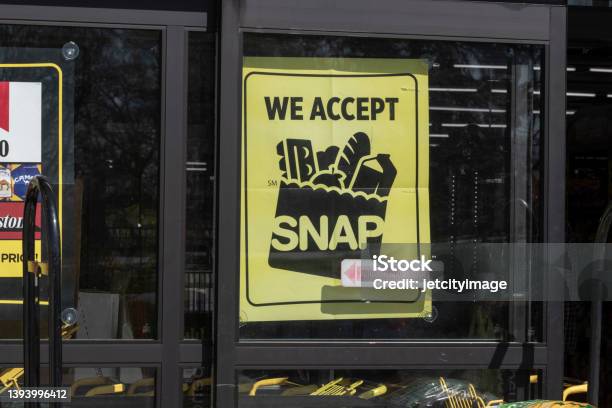 Snap And Ebt Accepted Here Sign Snap And Food Stamps Provide Nutrition Benefits To Supplement The Budgets Of Disadvantaged Families Stock Photo - Download Image Now