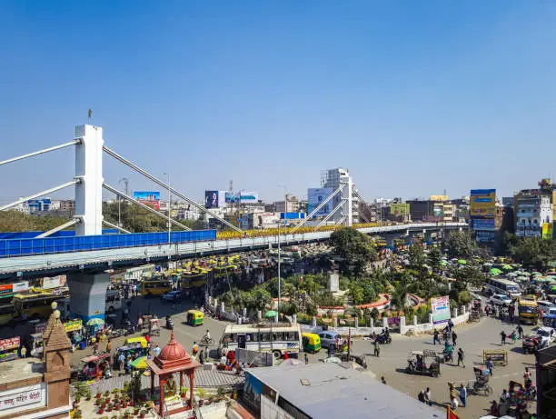 modern city construction with heavy traffic and bright blue sky at morning image is taken mahavir temple patna bihar india on Apr 15 2022.