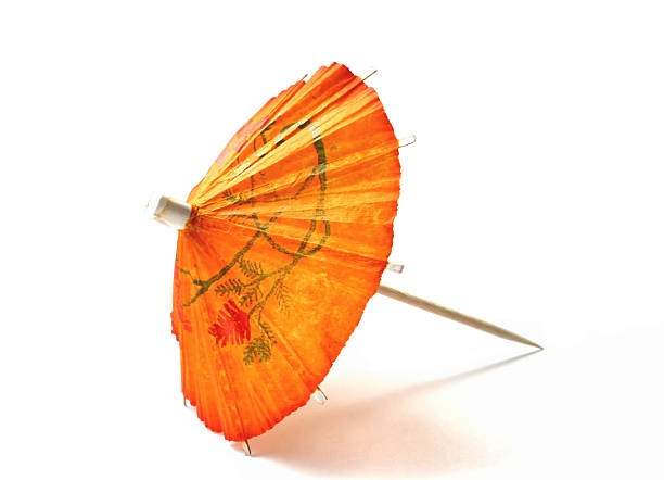 arancio ombrellino da cocktail - drink umbrella umbrella cocktail parasol foto e immagini stock