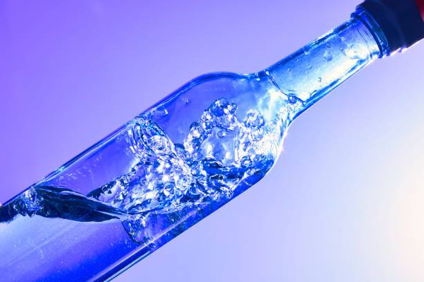 istock Liquids and bubbles in a blueback bottle 1394001753