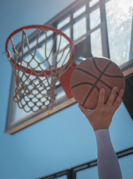Basketball Ball under the hoop. basketball player photos stock pictures, royalty-free photos & images