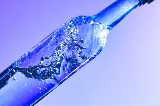 istock Liquids and bubbles in a blueback bottle 1394001803