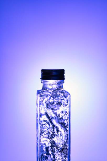 istock Liquids and bubbles in a blueback bottle 1394001877