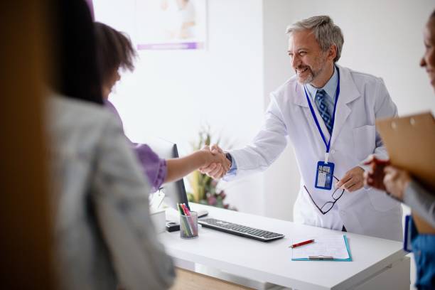 istock The doctor greets his patients in his office 1394002929
