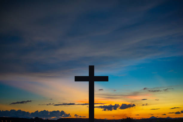 istock The Cross at the sunset background 1394004075