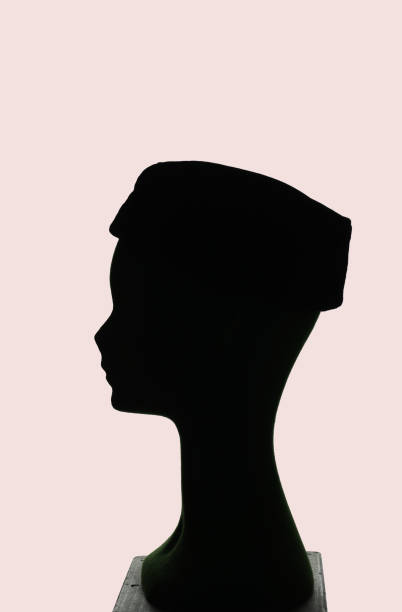 istock puppet head silhouette profile wearing tambourine hat 30's 1394004377