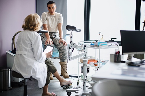 A female soldier is being examined by a gynecologist