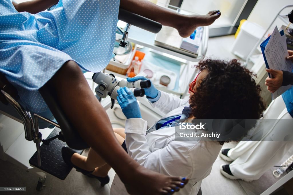 Hysteroscopy procedure Female gynecologist performing hysteroscopy procedure to her patient Uterus Stock Photo