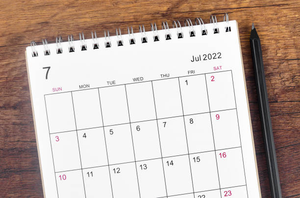 istock July 2022 desk calendar on wooden table. 1394005550