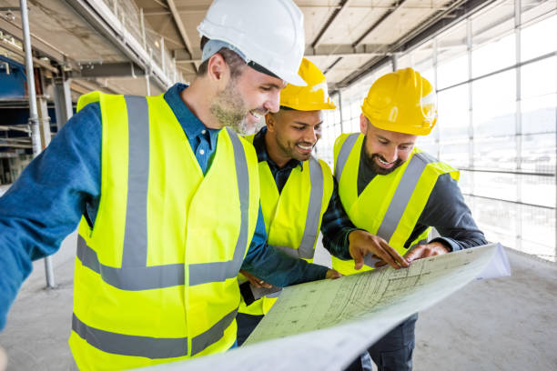 istock Architect and builders at an indoor construction site 1394005579