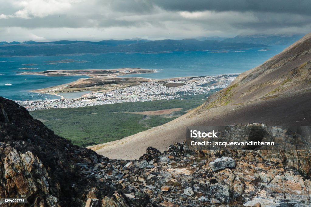 View of Ushuaia, the southernmost city in the world, in Argentina. Photo was taken from the mountains north of the city. View of Beagle Canal and the southern mountain range Ushuaia Stock Photo