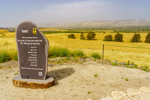 Beit Yosef, Israel - April 25, 2022: View of the Tel Ishmael observation point and Golani Memorial, and Lower Jordan River valley landscape, Northern Israel