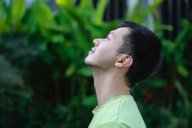 istock Young Indonesian Man Enjoying Quiet in the Nature 1394008091