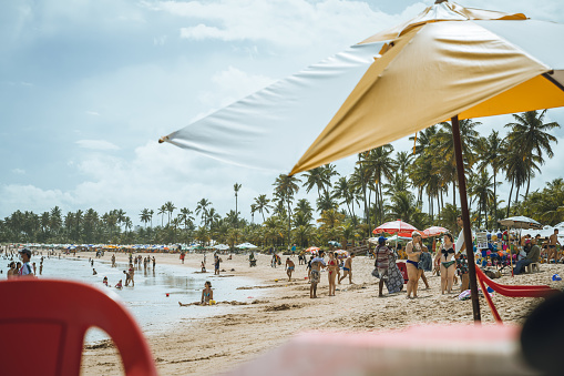 Salvador, Brazil - January 7, 2022: beach scene in Guarajuba– Bahia, Brazil