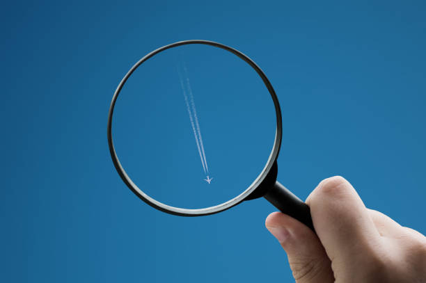 istock Focusing on an airplane in the sky 1394008247