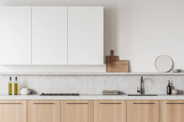 istock Bright kitchen room interior with gas cooker, sink, towels, soap 1394009064