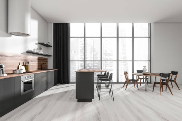 istock Bright kitchen room interior with eating island, barstools, panoramic window 1394009172