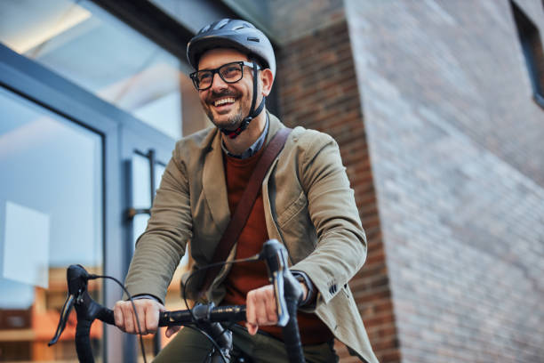 istock City commuters. Businessman going to work by bike 1394009190