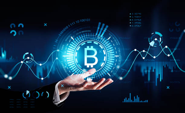 istock Businessman wearing suit is holding digital interface with bitcoin cryptocurrency 1394009315
