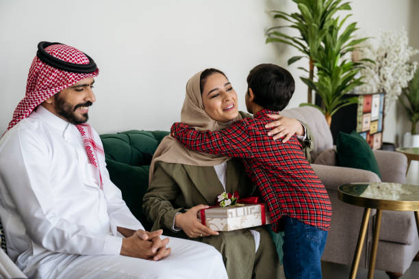 istock Mother and son embracing during Eid al-Fitr gift exchange 1394010509