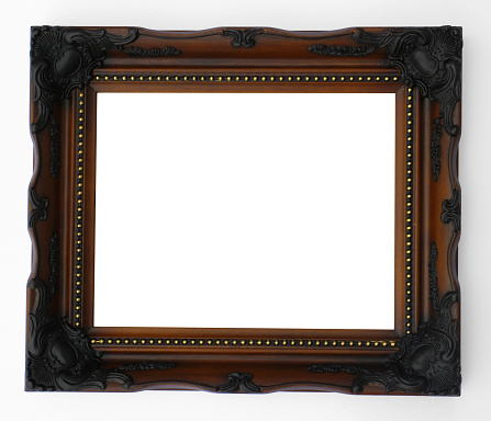 A dark wooden empty ornate style frame with room for your image/text.