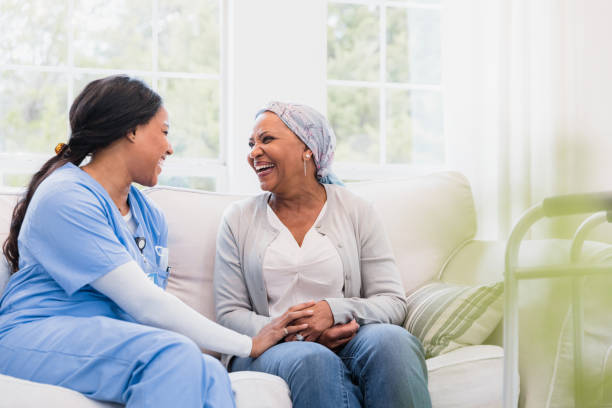 istock Nurse and patient laugh together 1394015924