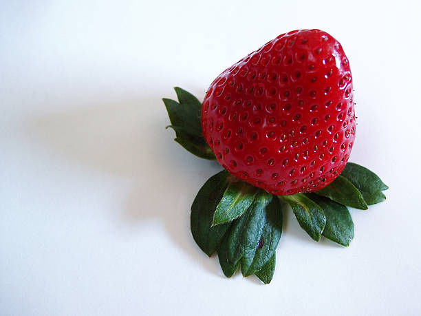 Stunning And Detailed Close-Up Of A Beautiful Red Organic Strawb stock photo