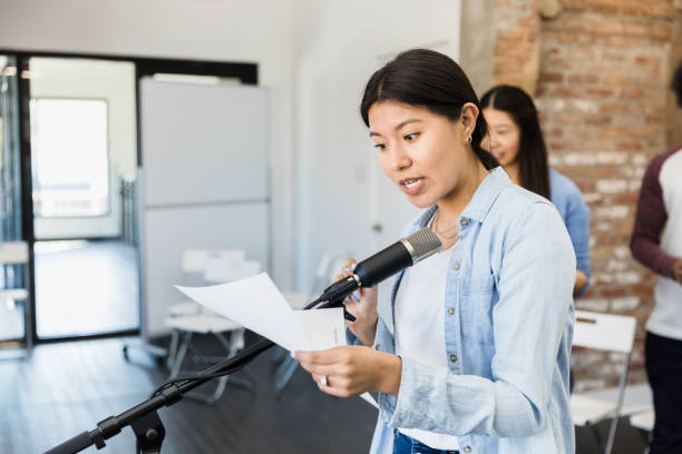 istock Mid adult woman reads part from the script with emotion 1394017843