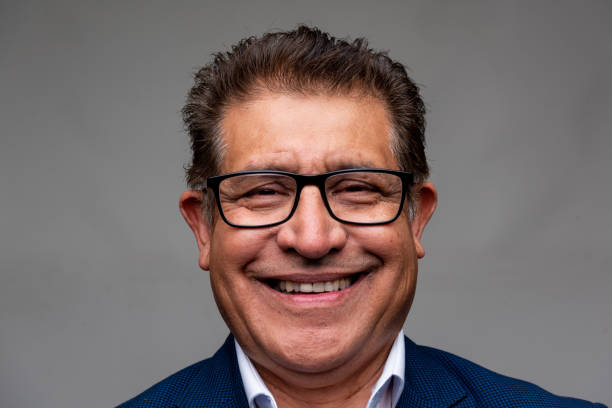 istock Smiling Hispanic senior man front mugshot 1394019217
