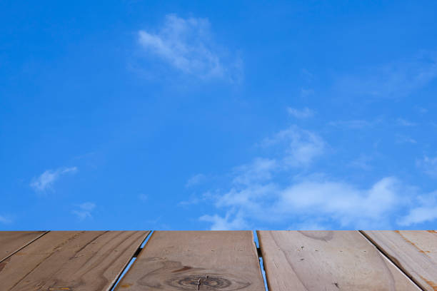 Blurred wooden table on the background sky