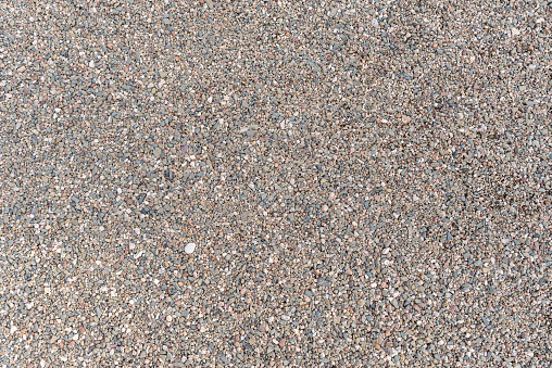 Top view of textured pebble stones ground