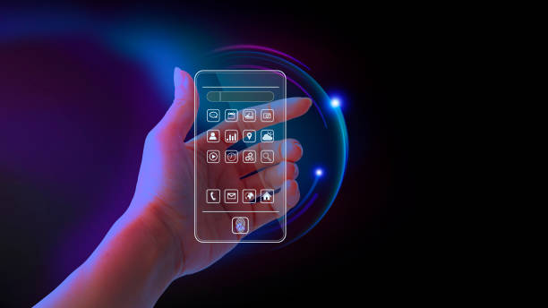 Metaverse and blockchain technology concepts. Hand holding a virtual interface screen to an online database smartphone. Futuristic tone purple, neon color. Screen transparent presents the app mobile. Futuristic stock photo