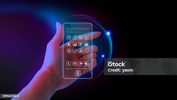 Metaverse And Blockchain Technology Concepts Hand Holding A Virtual Interface Screen To An Online Database Smartphone Futuristic Tone Purple Neon Color Screen Transparent Presents The App Mobile Futuristic Stock Photo - Download Image Now