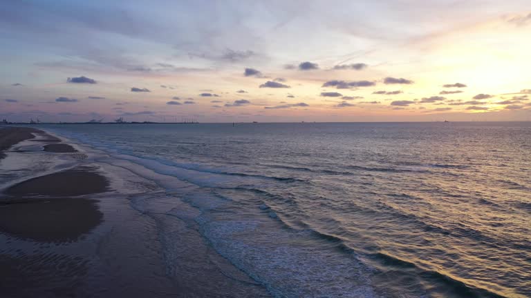 Aerial view of a sunset over the beach along the coast in Knokke, Belgium.