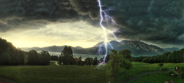 thunderstorm with lightning strikes over the alps at lake attersee, salzburg austria, concept for insurance damage, security, severe weather and climate change - austria tirol cloud land imagens e fotografias de stock