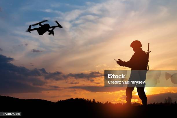 Silhouette Of Soldier Are Using Drone And Laptop Computer For Scouting During Military Operation Stock Photo - Download Image Now
