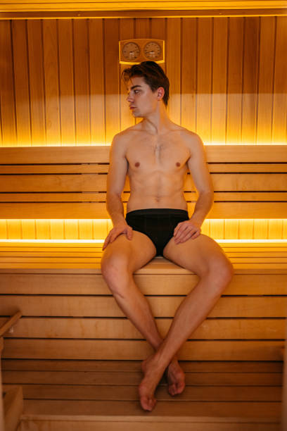 istock Young Man Relaxing In Sauna 1394027646